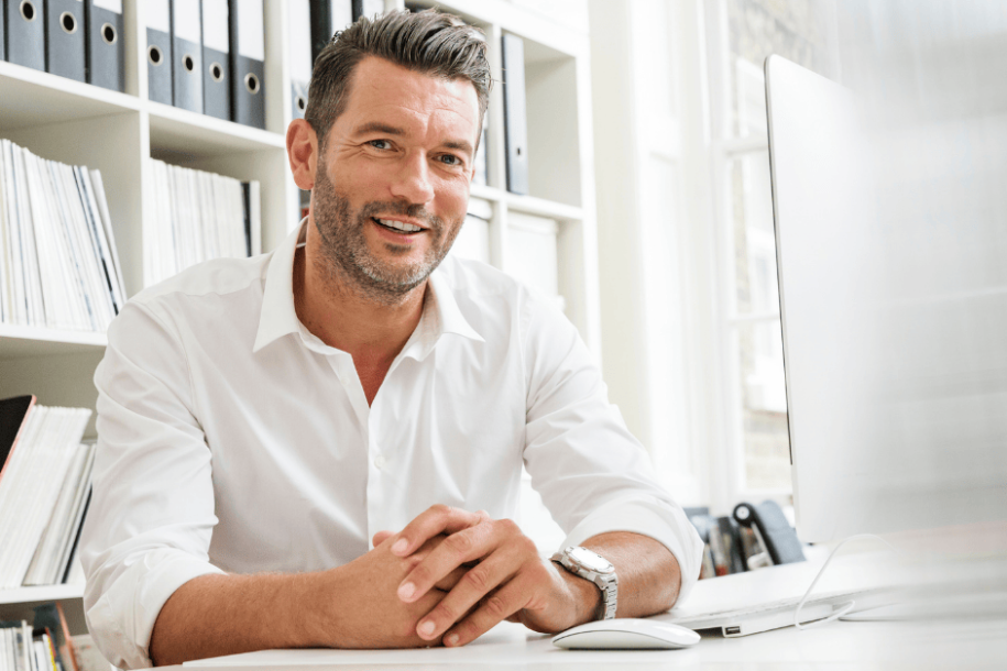 man at desk patient at desk
